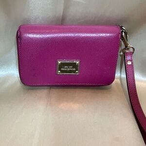 Michael Kors pink leather wristlet wallet.   8-H7B